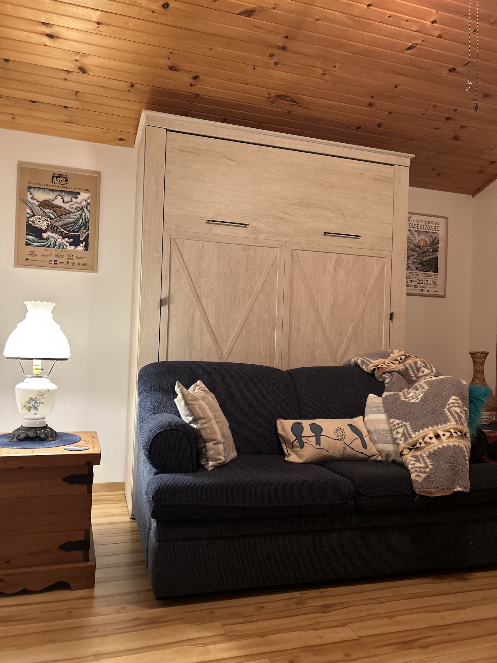 Living room with a queen Murphy bed at Blue Heron Hideaway